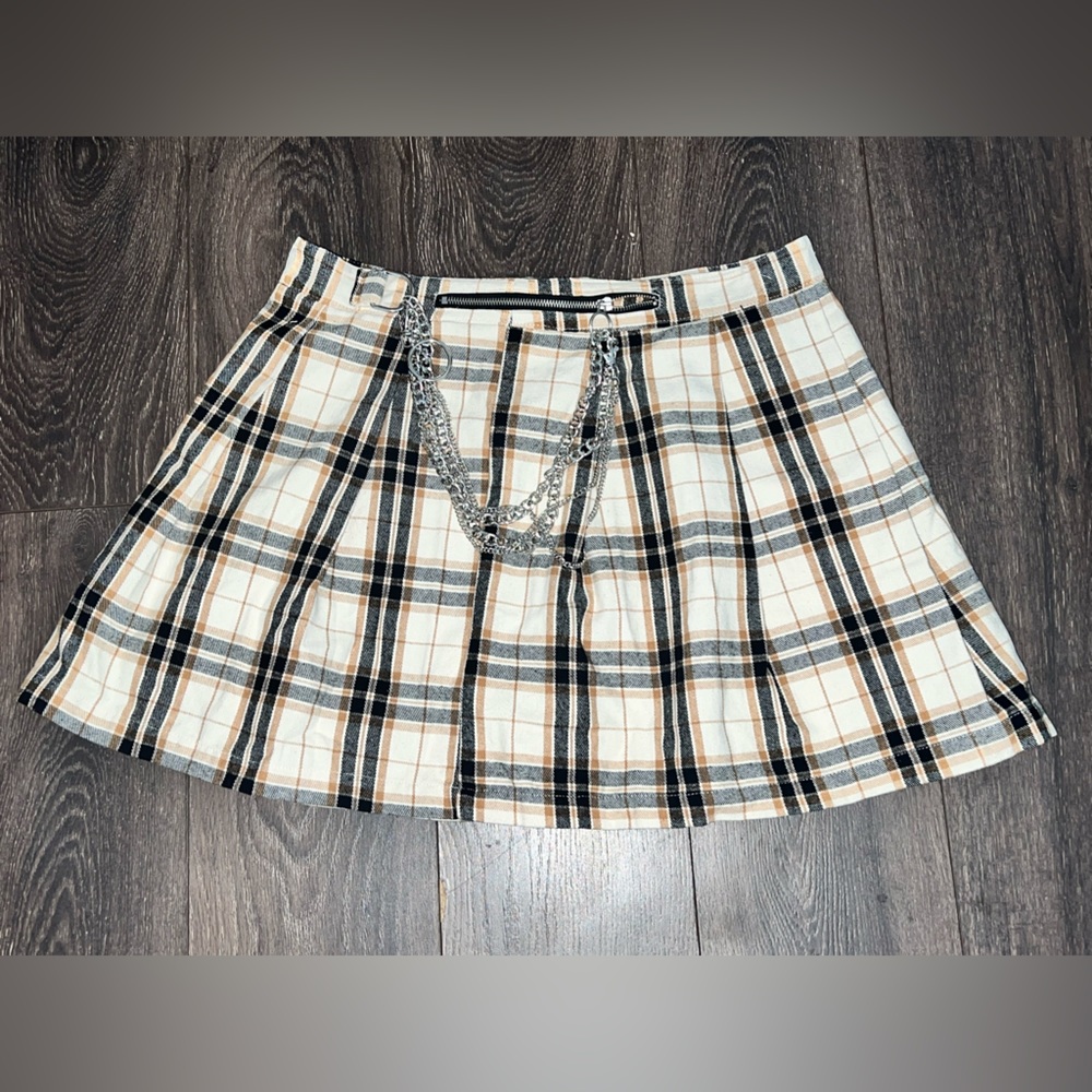 Plaid Pleated Mini Skirt .